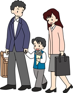 お墓参りの家族